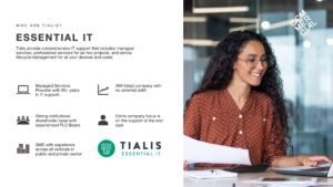Essential IT slide from the DaaS presentation associated with Tialis with a woman at work using her laptop and holding printed documents