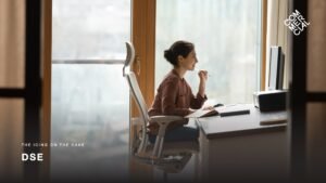 DSE slide for stakeholder reviews featuring an image of a woman at her work desk in an ergonomic and adjustable chair