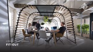 Fit-Out slide for stakeholder reviews featuring an image of a modern office workspace covering